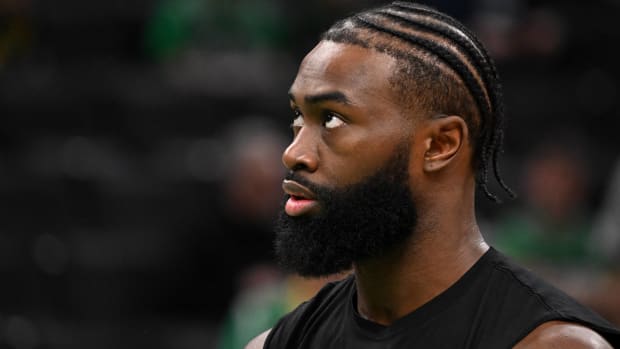 Celtics forward Jaylen Brown looks on during warm-ups before a game.